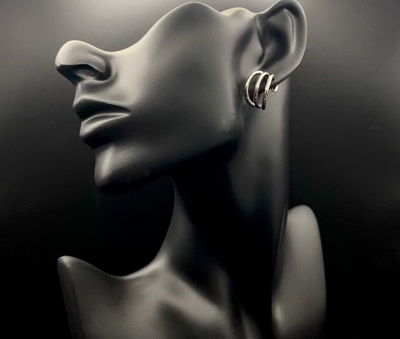 “Trinity 3 Band C Shaped Earrings Silver: A perfect blend of elegance and modern design, featuring sleek silver plating, a unique three-band C shape, and durable stainless steel construction. Ideal for both everyday wear and special occasions.”