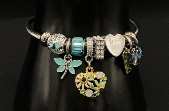 “Stellar Charm Bracelet in blue with playful charms including a heart, butterfly, and cube, crafted from high-quality stainless steel. Suitable for both women and kids, making it a perfect gift for any occasion.”