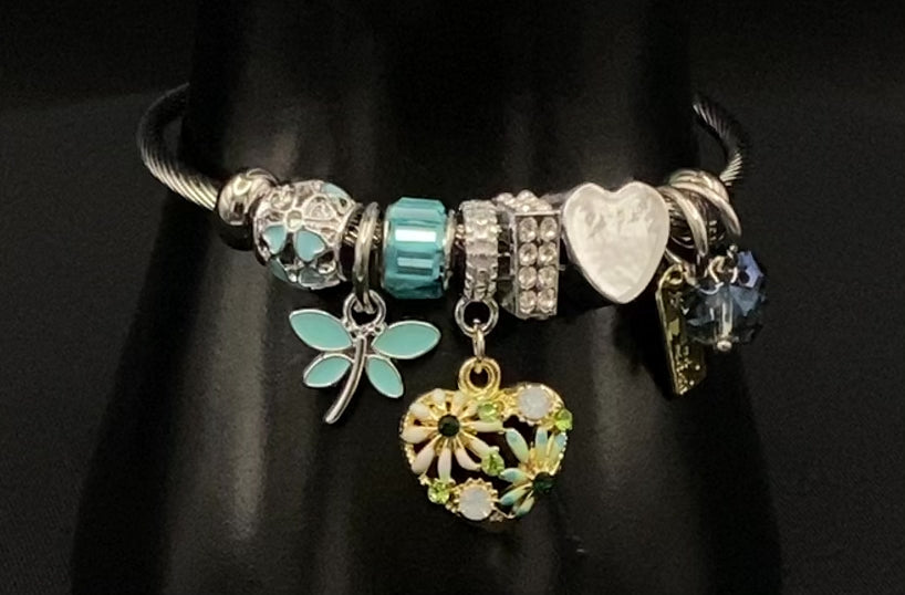 “Stellar Charm Bracelet in blue with playful charms including a heart, butterfly, and cube, crafted from high-quality stainless steel. Suitable for both women and kids, making it a perfect gift for any occasion.”
