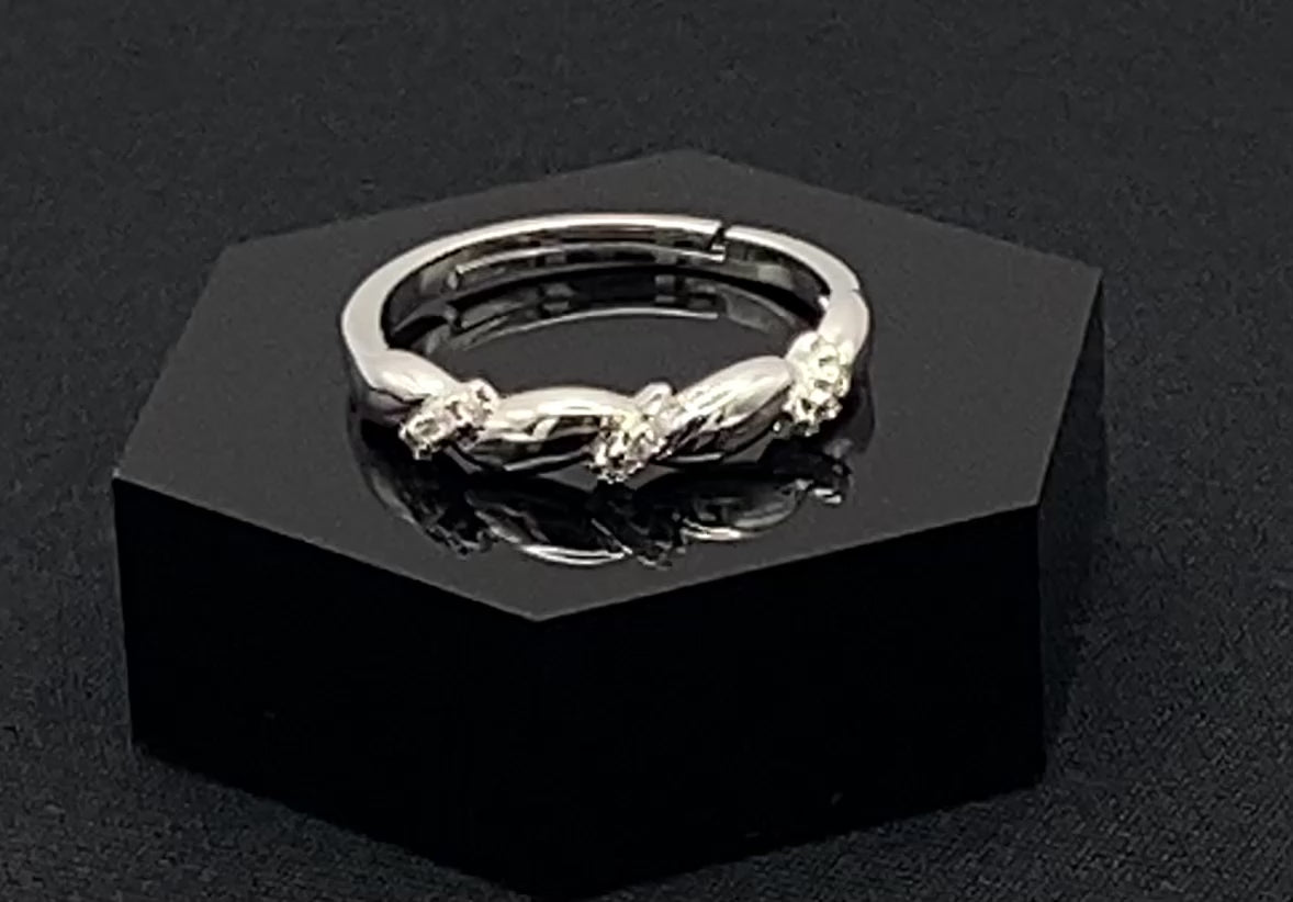 Olivia Adjustable Ring Silver: This exquisite piece plated, offering a luxurious shine and timeless appeal. The ring is waterproof and non-tarnish, ensuring it maintains its beauty over time. Cubic zirconia accents add sparkle and elegance, while the adjustable design ensures a perfect fit for any finger size. Make a statement with this stunning piece that complements any look.
