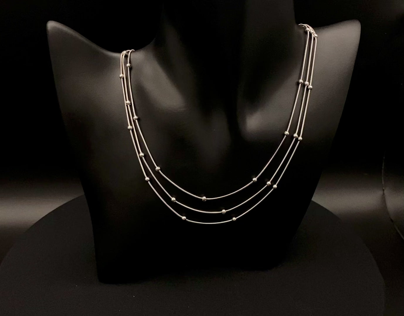 Freya Tri-Chain Bead Necklace Silver, Elegant tri-chain design with bead accents. silver plated, PVD plated for durability. Adjustable length: 40 cm + 5 cm extender. Versatile for layering or solo wear.
